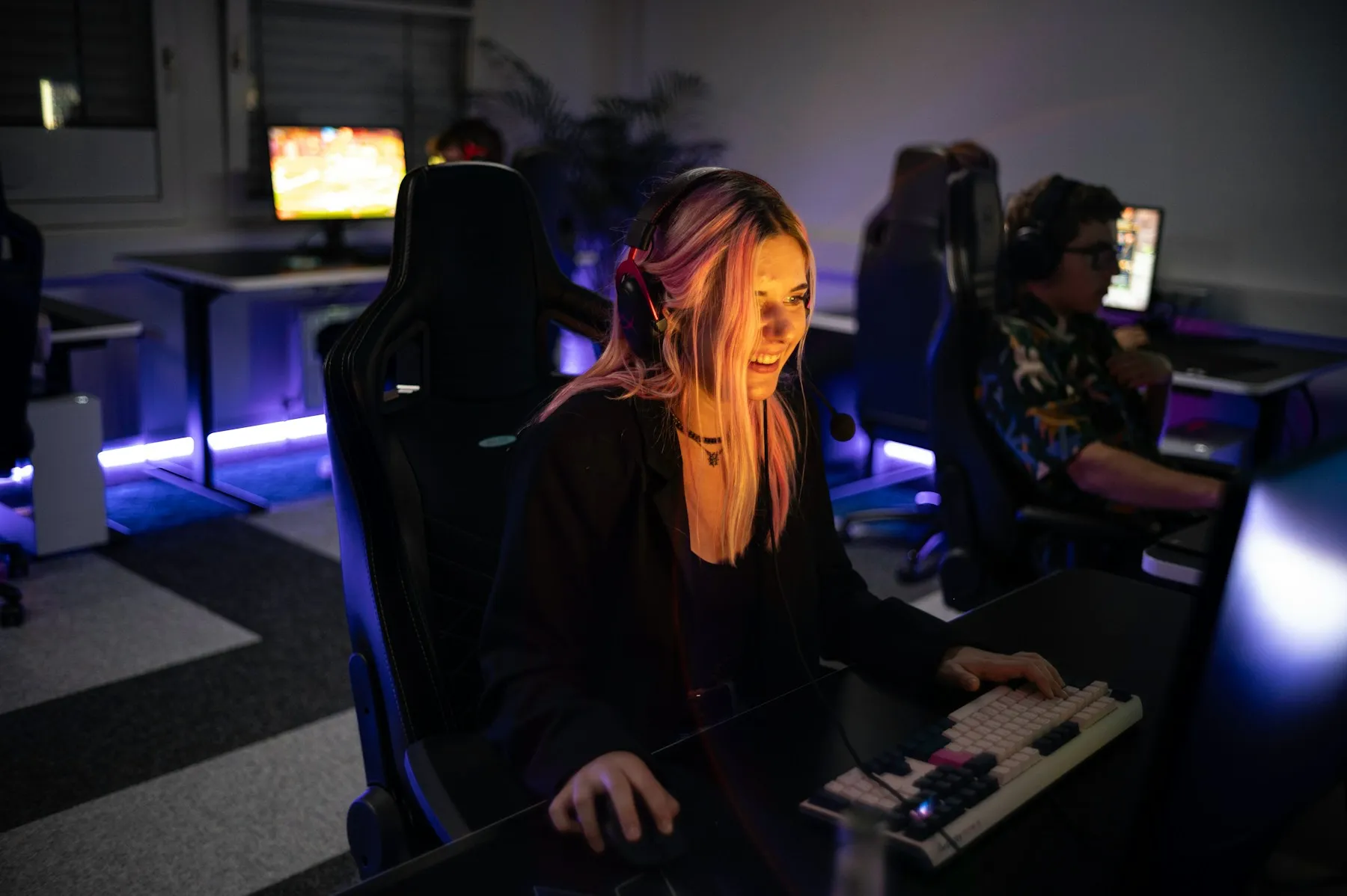 A player focused at a gaming computer