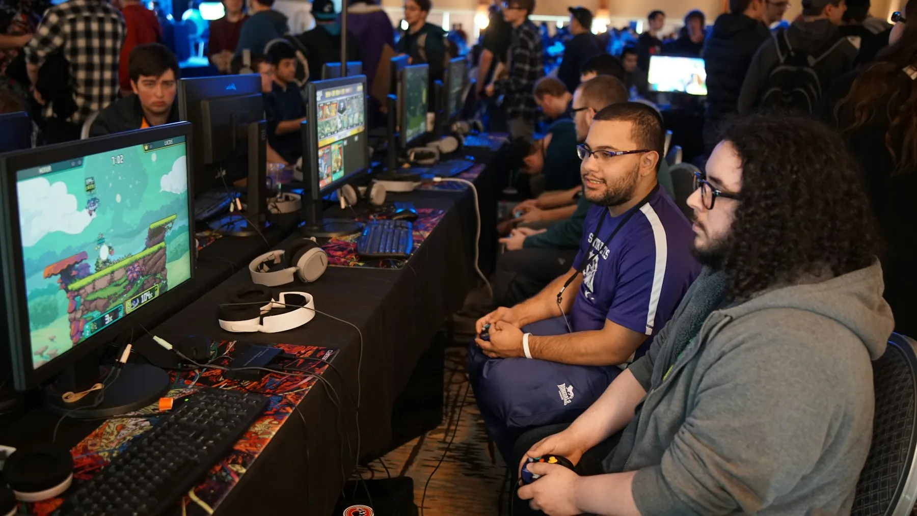 A group of competitors playing together at a gaming event