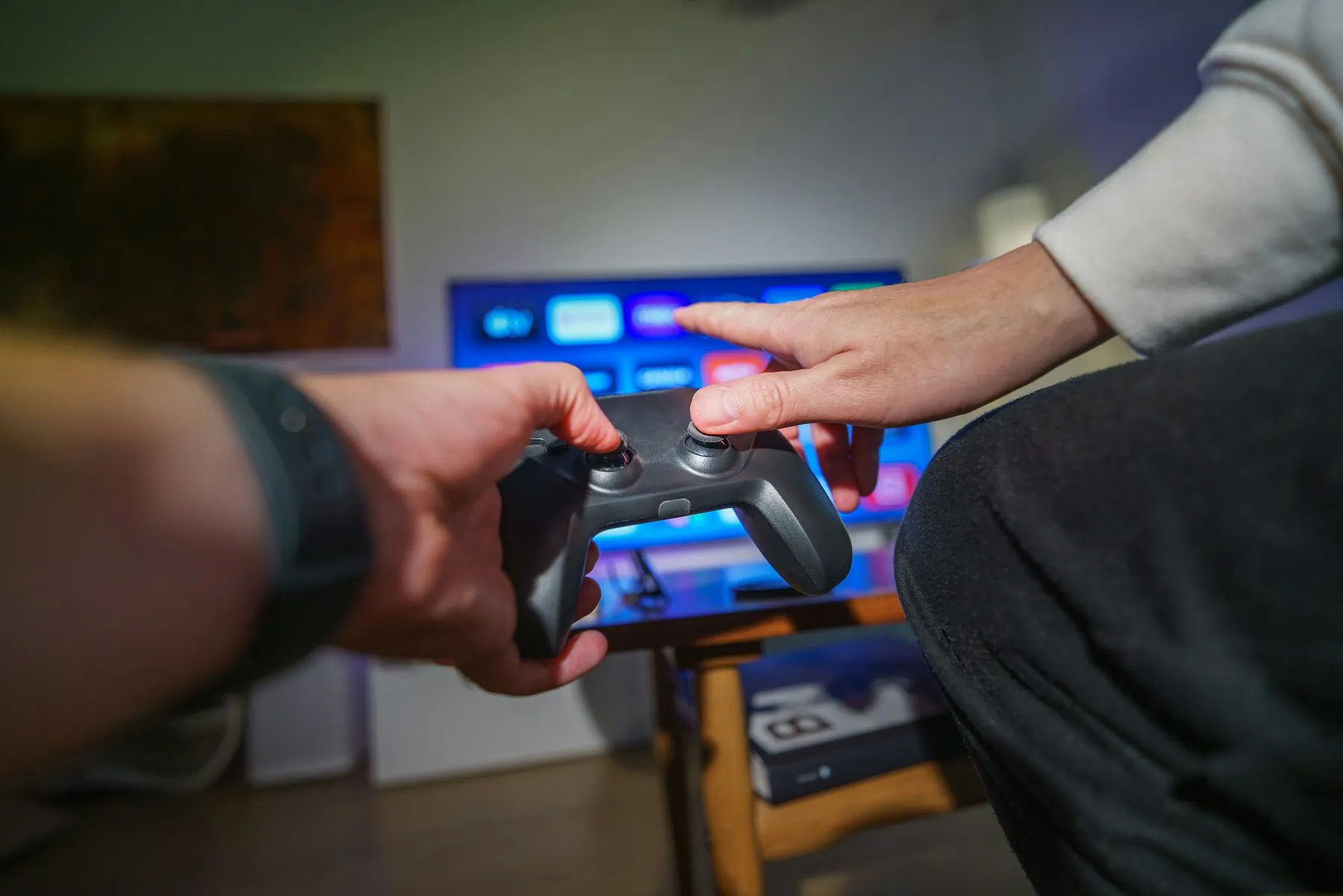 A player holding a wireless game controller