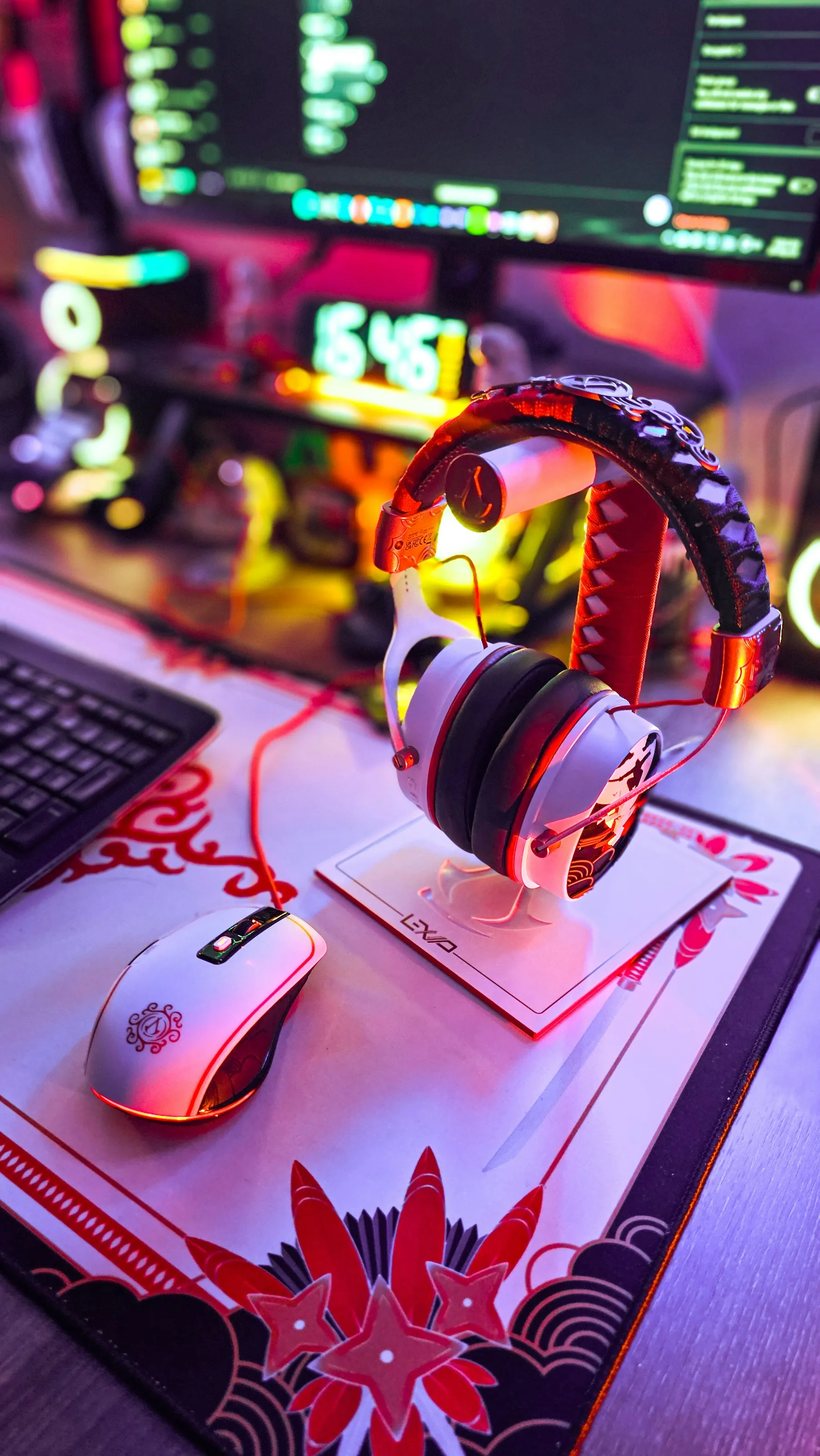 Gaming headphones and a mouse on a colorful desk
