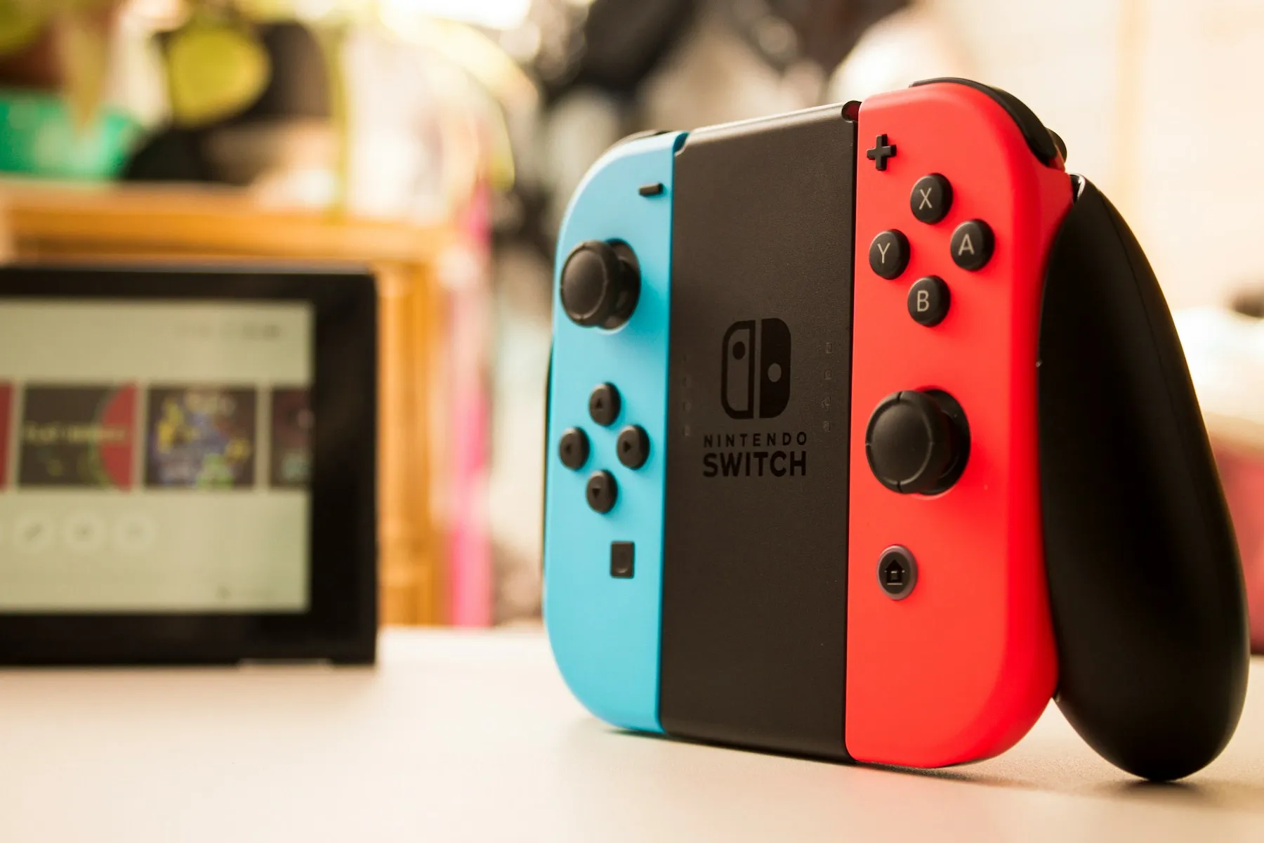 A Nintendo Switch with red and blue controllers