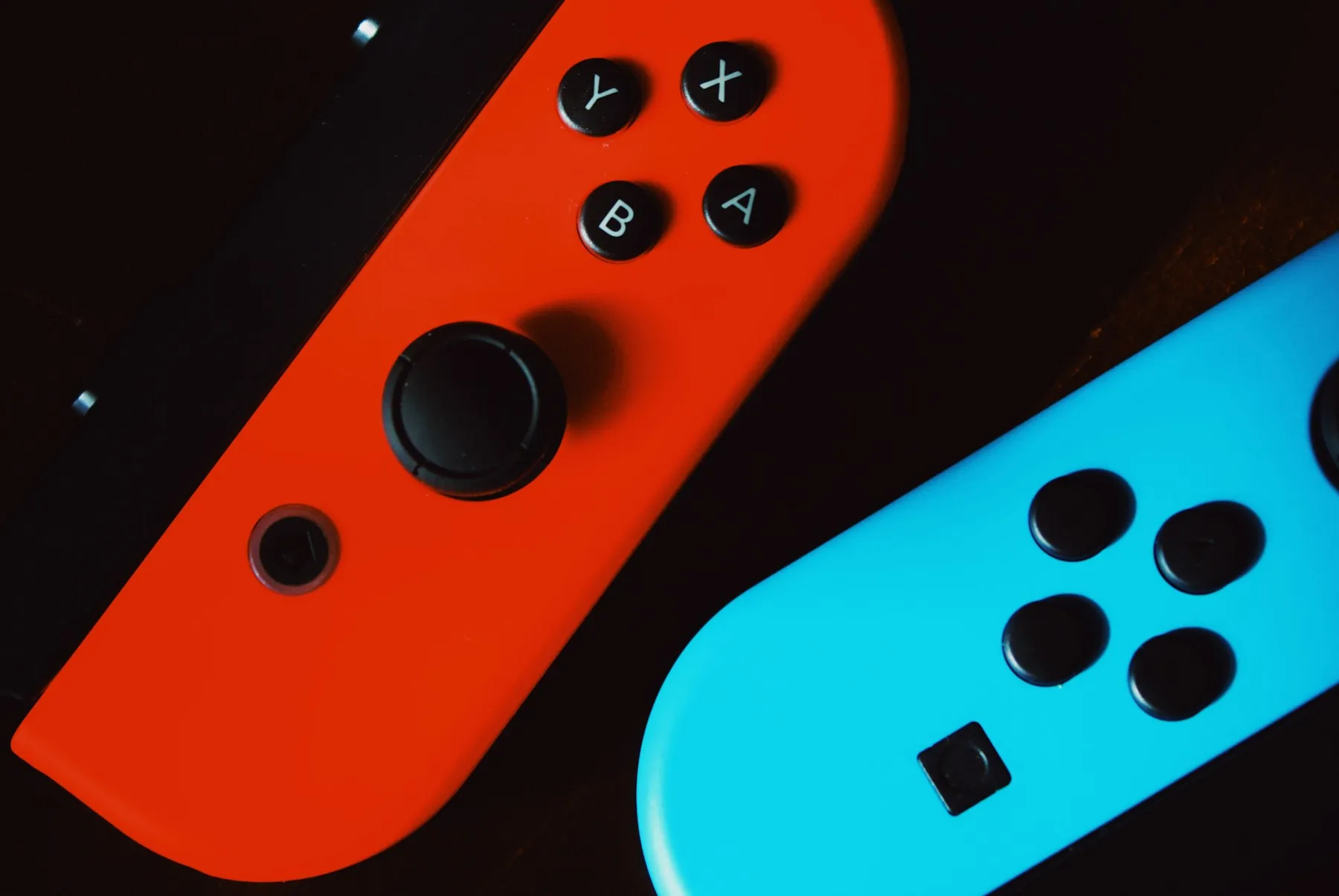 Nintendo Switch controllers on a dark surface